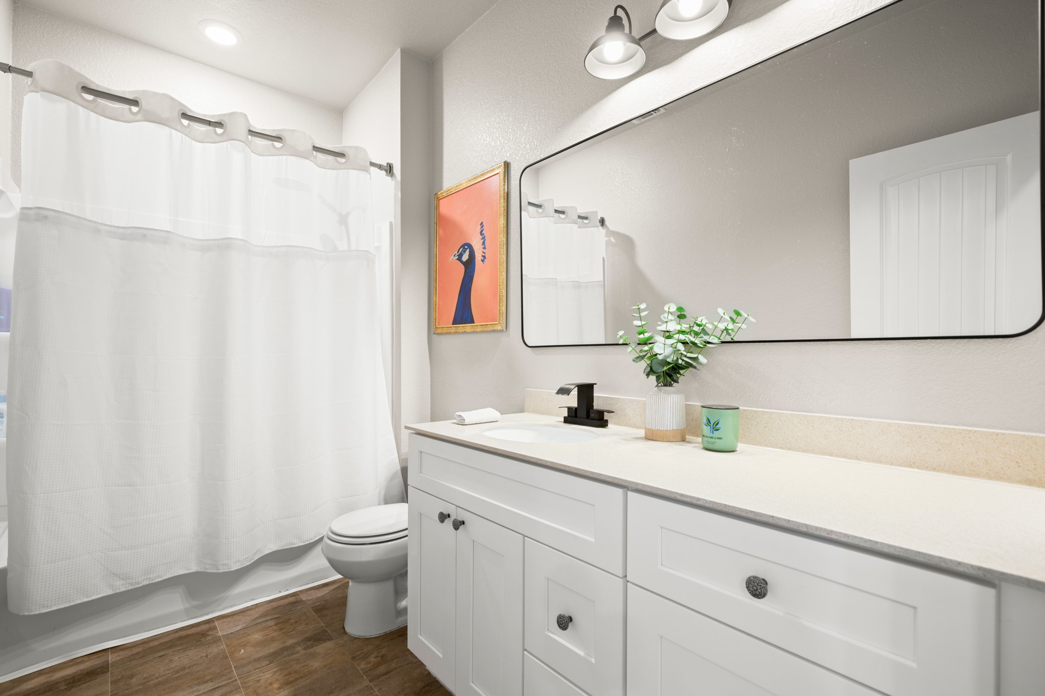 101 Kavanaugh Street Georgetown, TX 78628 - Photo 23 of 32 a bathroom with a sink a toilet and a mirror