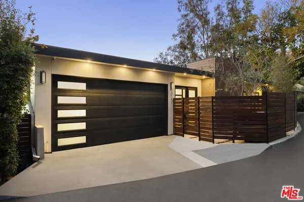 a front view of a house with a garage