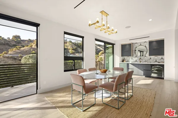 a view of a dining room with furniture window and outside view