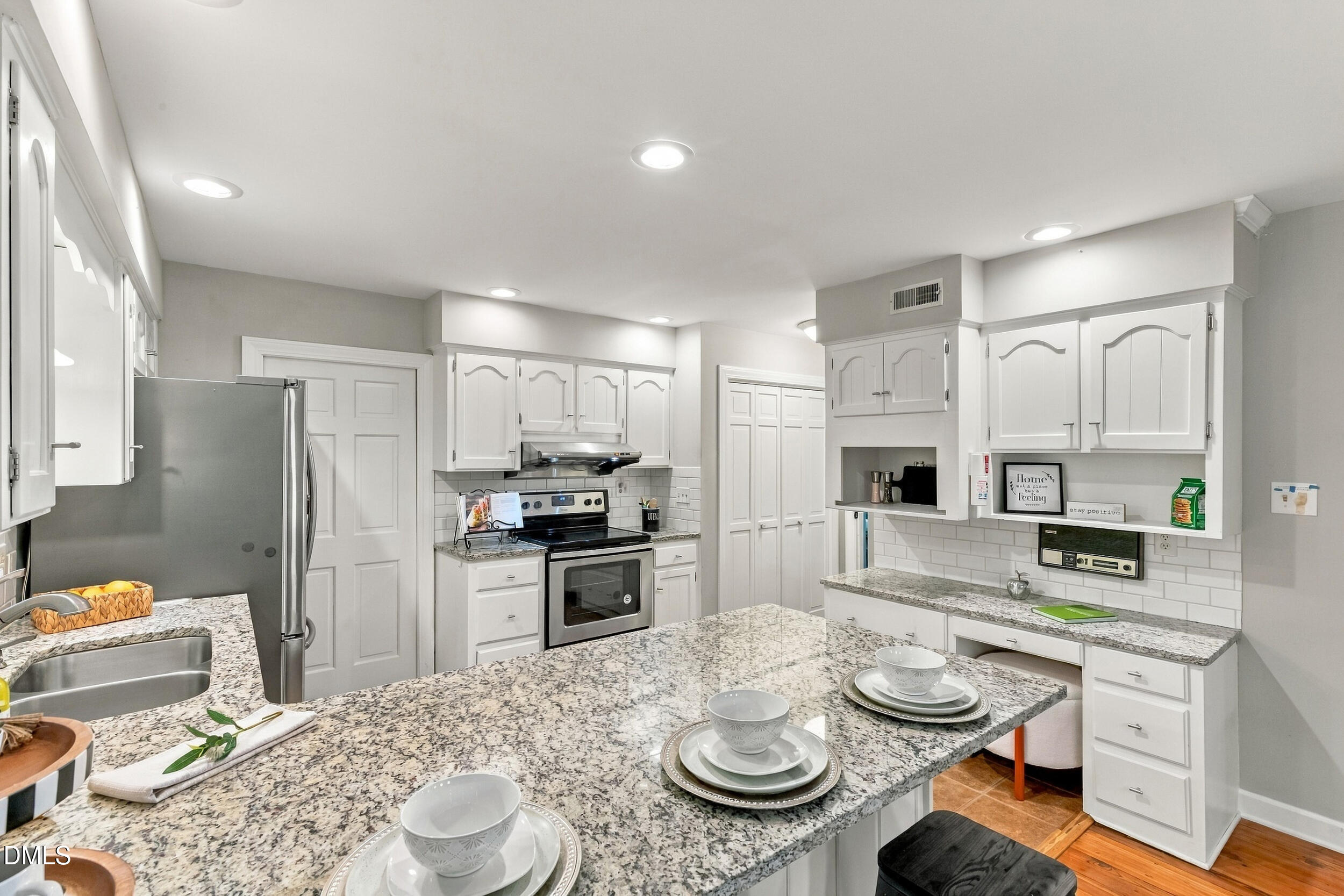 2329 Win Road Garner, NC 27529 - Photo 32 of 90 Kitchen featuring white cabinetry, granite countertops, stainless steel appliances, a subway tile backsplash, and recessed lighting