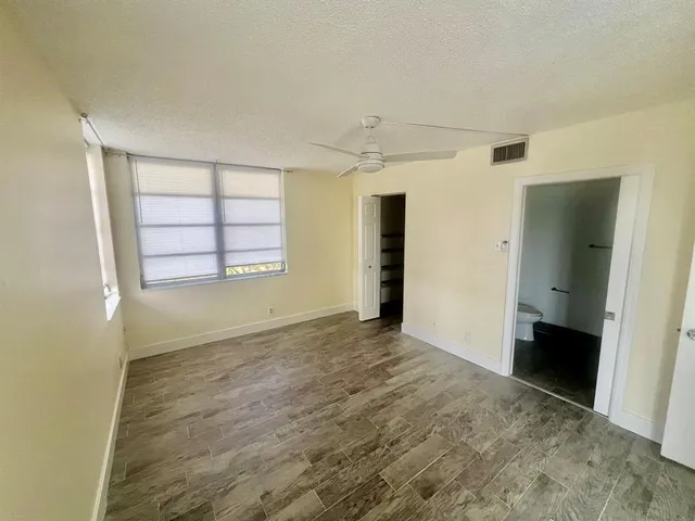 a bathroom with a sink toilet tub and shower