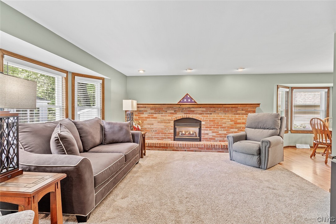 7653 Doubletree Circle Clay, NY 13212 - Photo 6 of 38 living room w/ gas fireplace