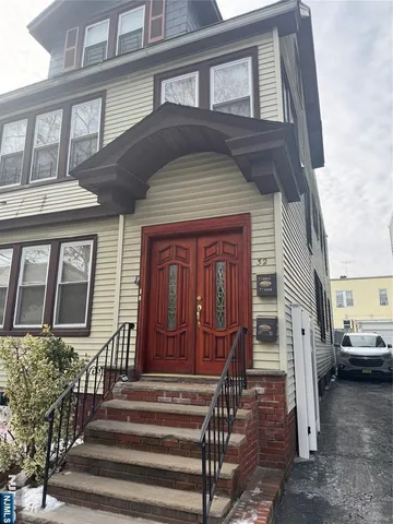a front view of a house with a porch