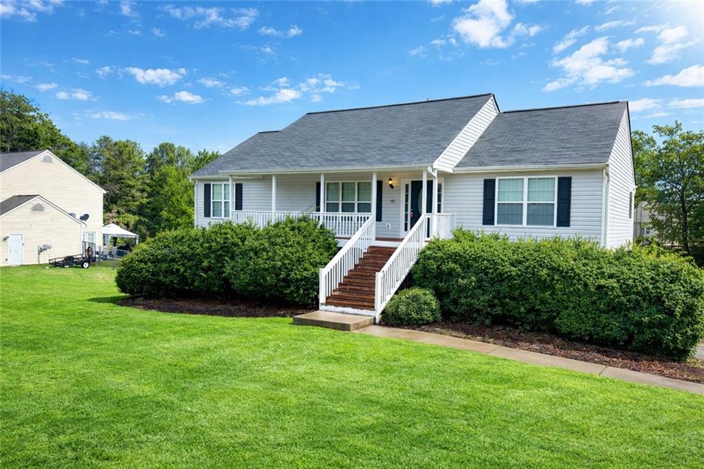 a front view of a house with a yard