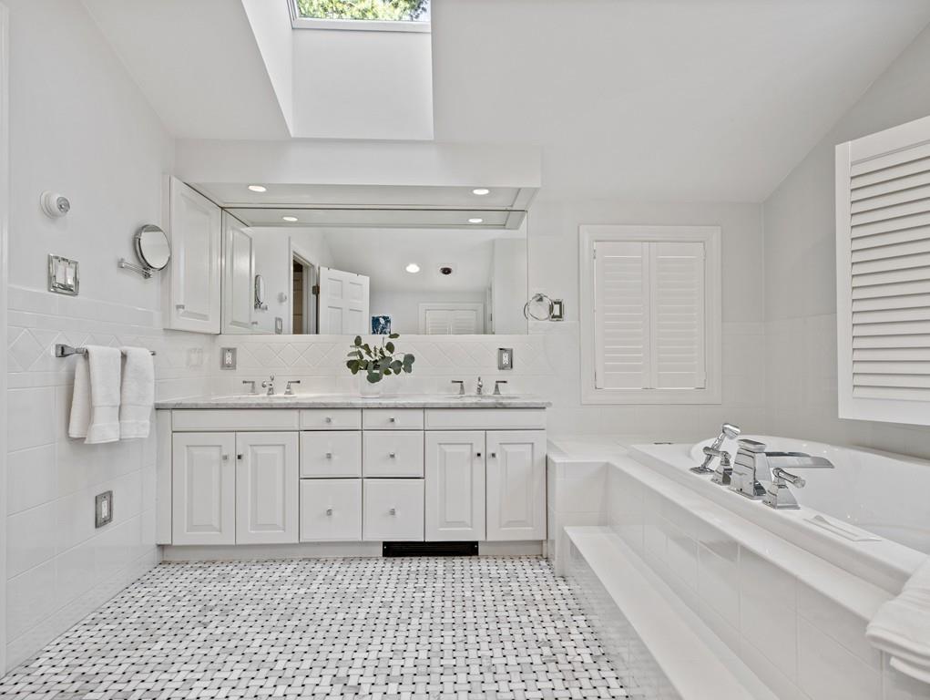 119 Hampshire Road Wellesley, MA 02481 - Photo 13 of 19 a spacious bathroom with a sink a mirror and a bathtub