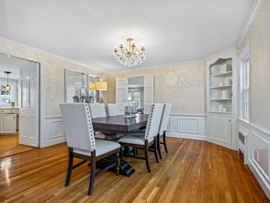 119 Hampshire Road Wellesley, MA 02481 - Photo 5 of 19 a view of a dining room with furniture a rug and wooden floor