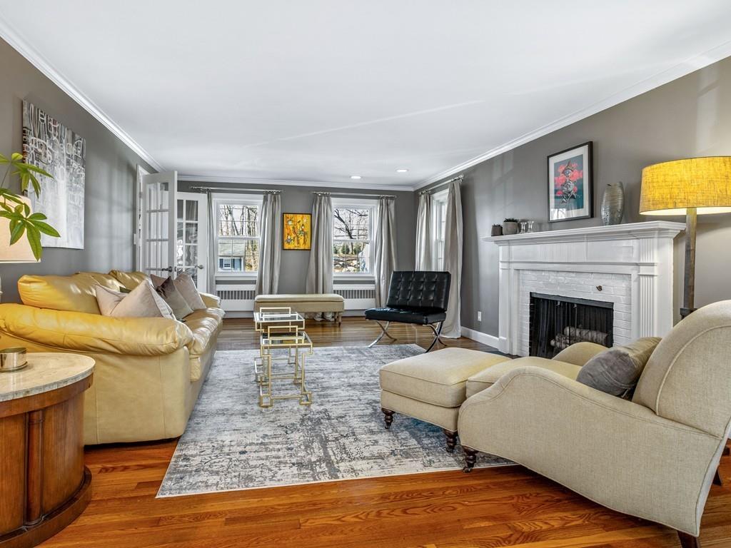 119 Hampshire Road Wellesley, MA 02481 - Photo 8 of 19 a living room with furniture and a fireplace
