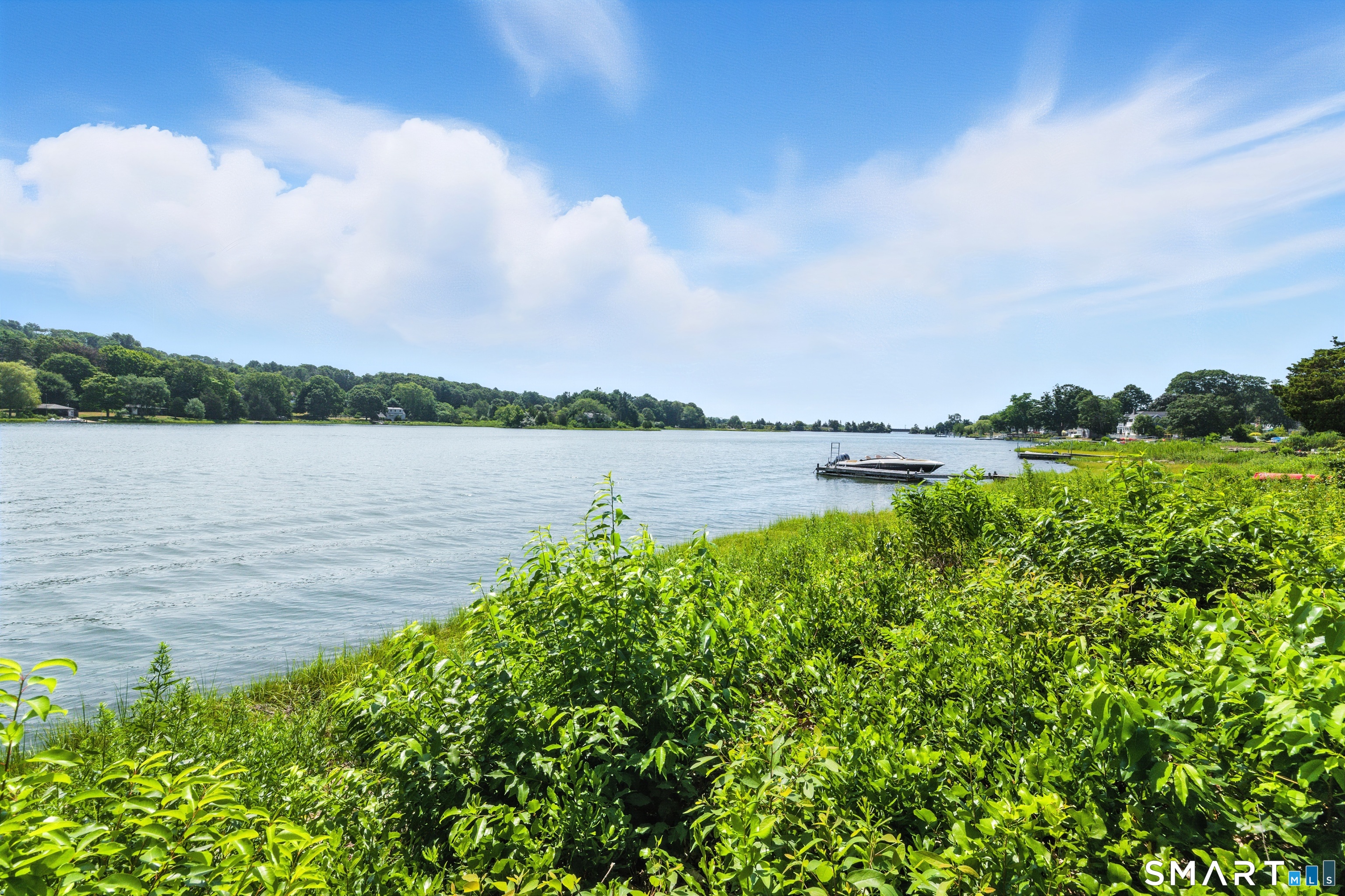 a view of a lake with a big yard