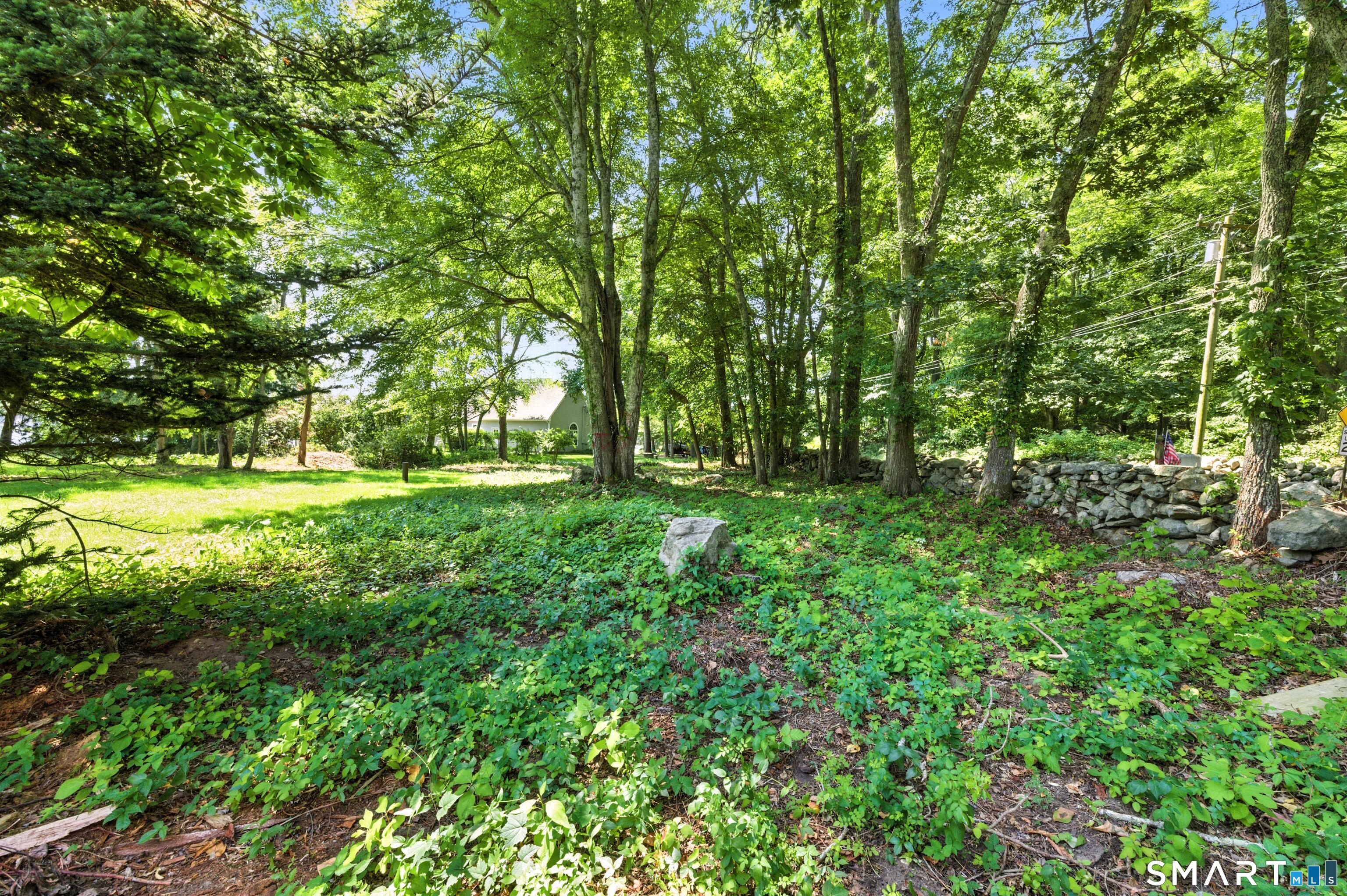 82 Cove Road Stonington, CT 06378 - Photo 19 of 20 a view of outdoor space with deck and yard