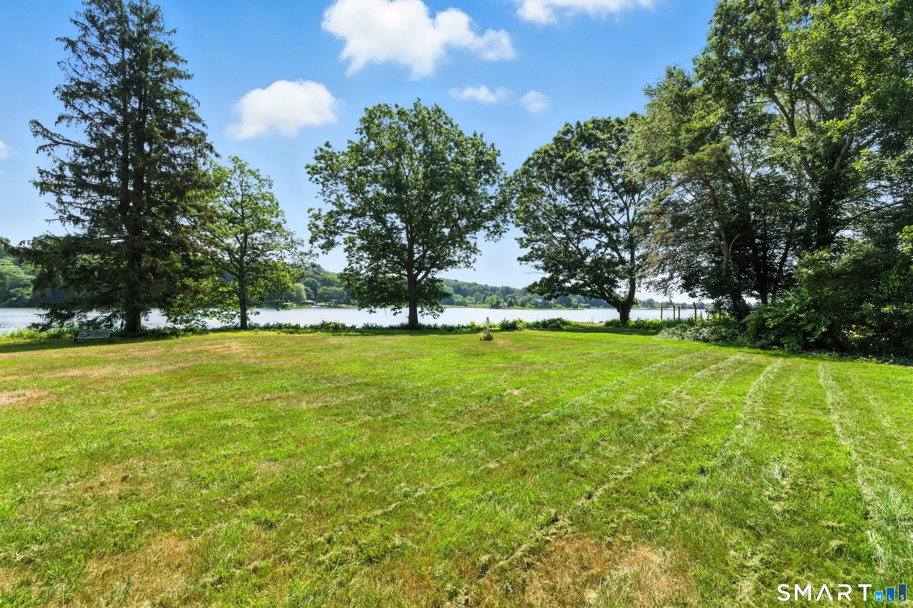 82 Cove Road Stonington, CT 06378 - Photo 3 of 20 a view of yard with swimming pool and green space