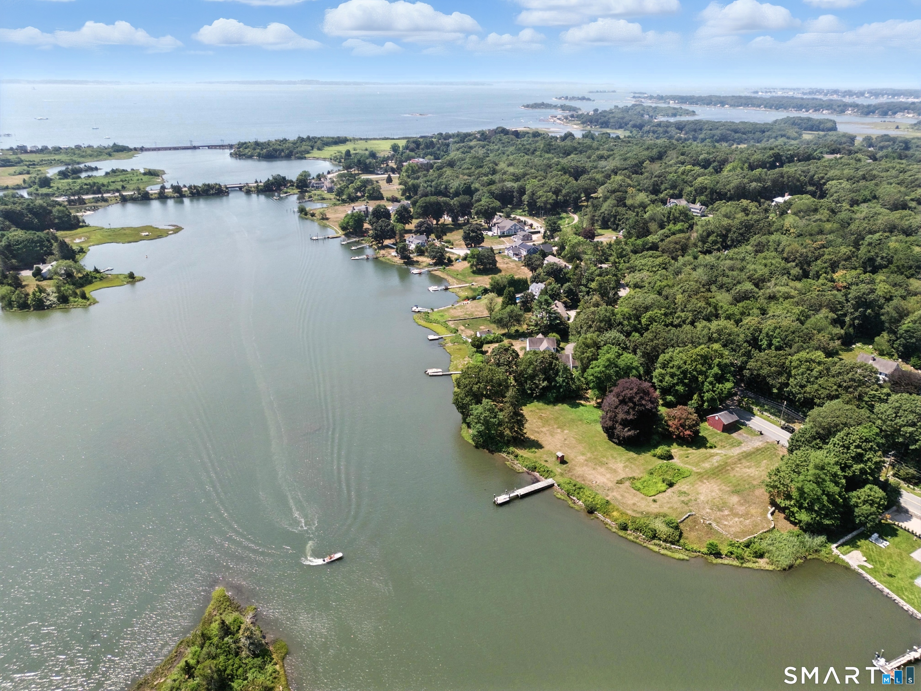 82 Cove Road Stonington, CT 06378 - Photo 4 of 20 an aerial view of ocean and residential houses with outdoor space