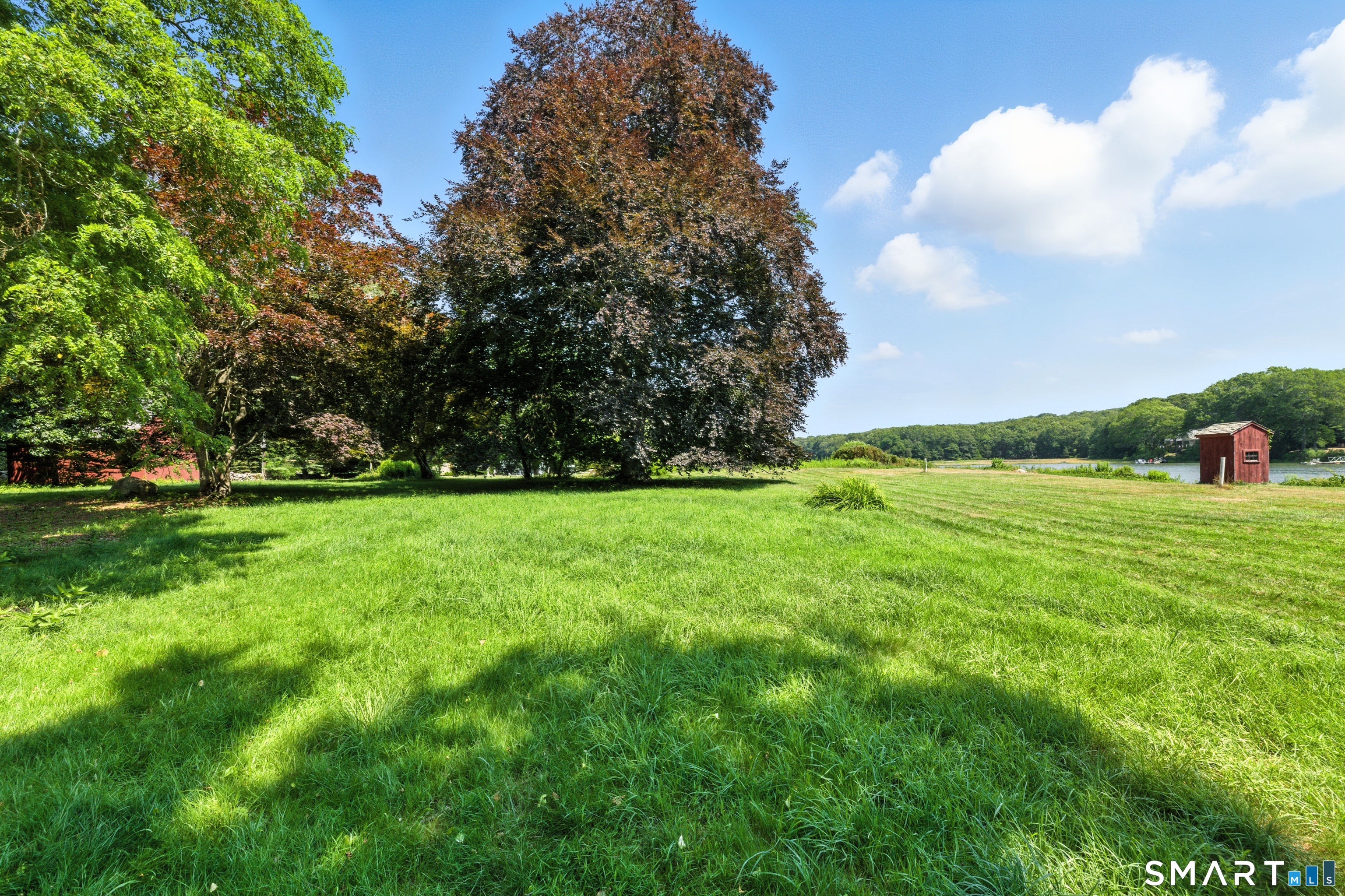 82 Cove Road Stonington, CT 06378 - Photo 5 of 20 a view of yard with green space