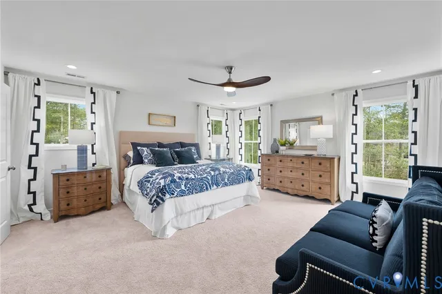 a bedroom with a bed and a couch