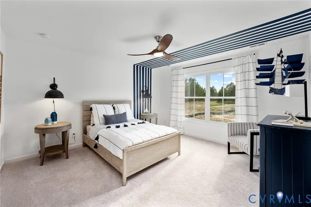 a spacious bedroom with a bed and a desk