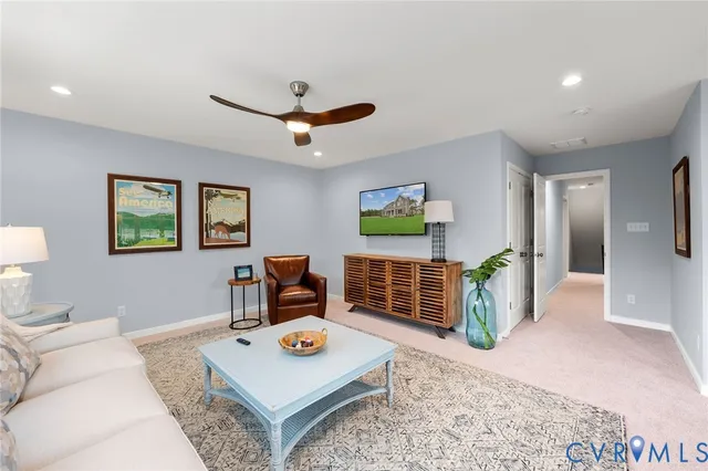 a living room with furniture and a table