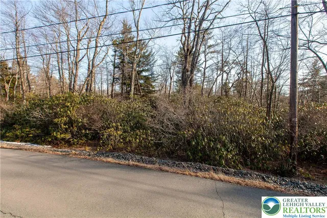 a view of a street with a building in the background