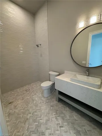 a bathroom with a bathtub and a toilet