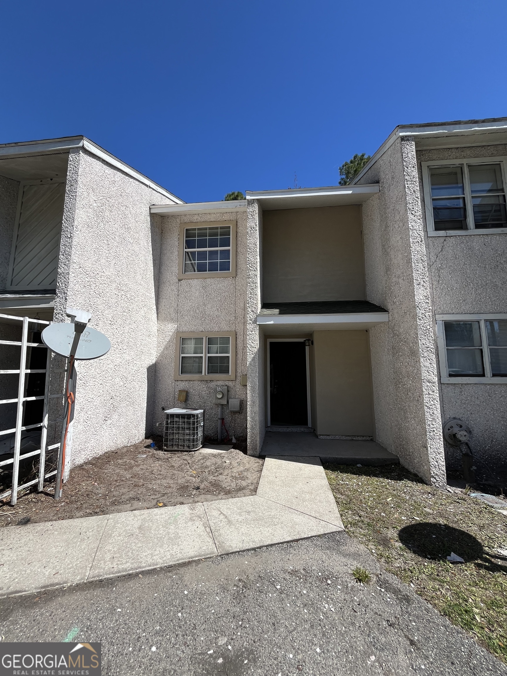 126 Inlet Reach Circle St. Marys, GA 31558 - Photo 1 of 15 a view of a house with a flat screen tv