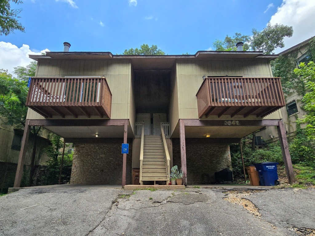 a view of a patio with a table and chairs