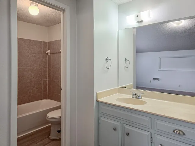 a bathroom with a toilet and shower