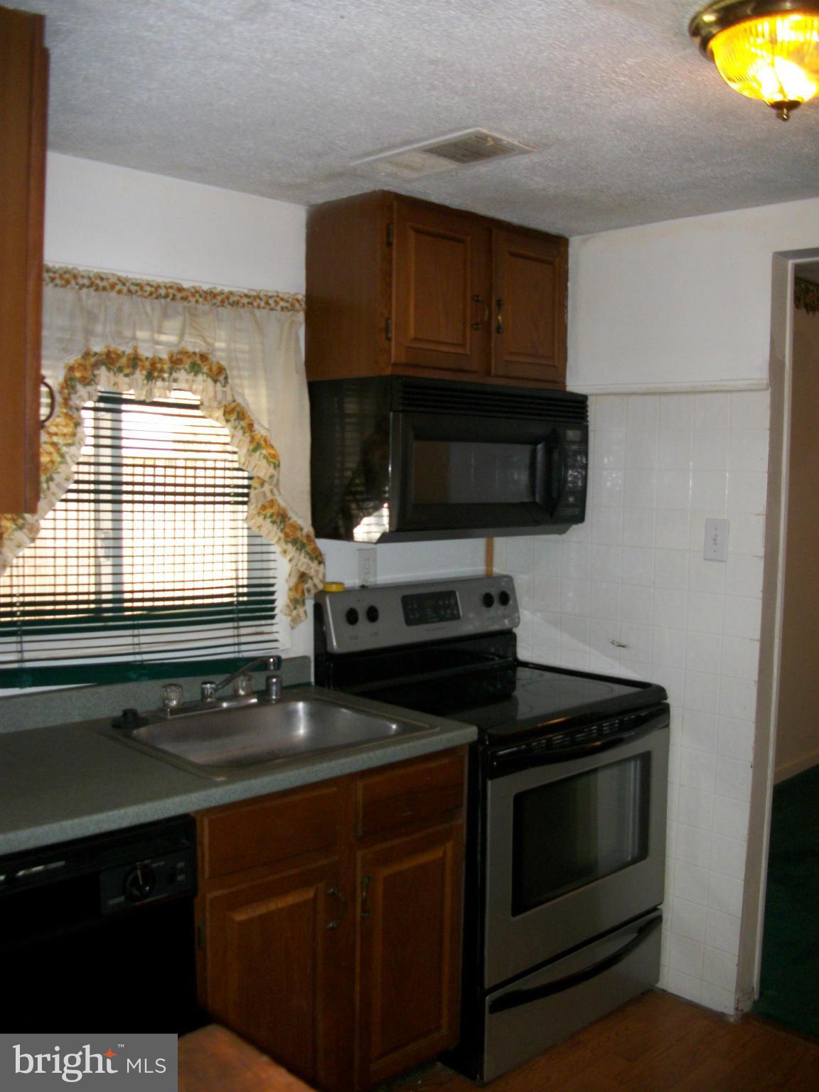 8573 Beacon Point Road Pasadena, MD 21122 - Photo 4 of 8 Galley Kitchen