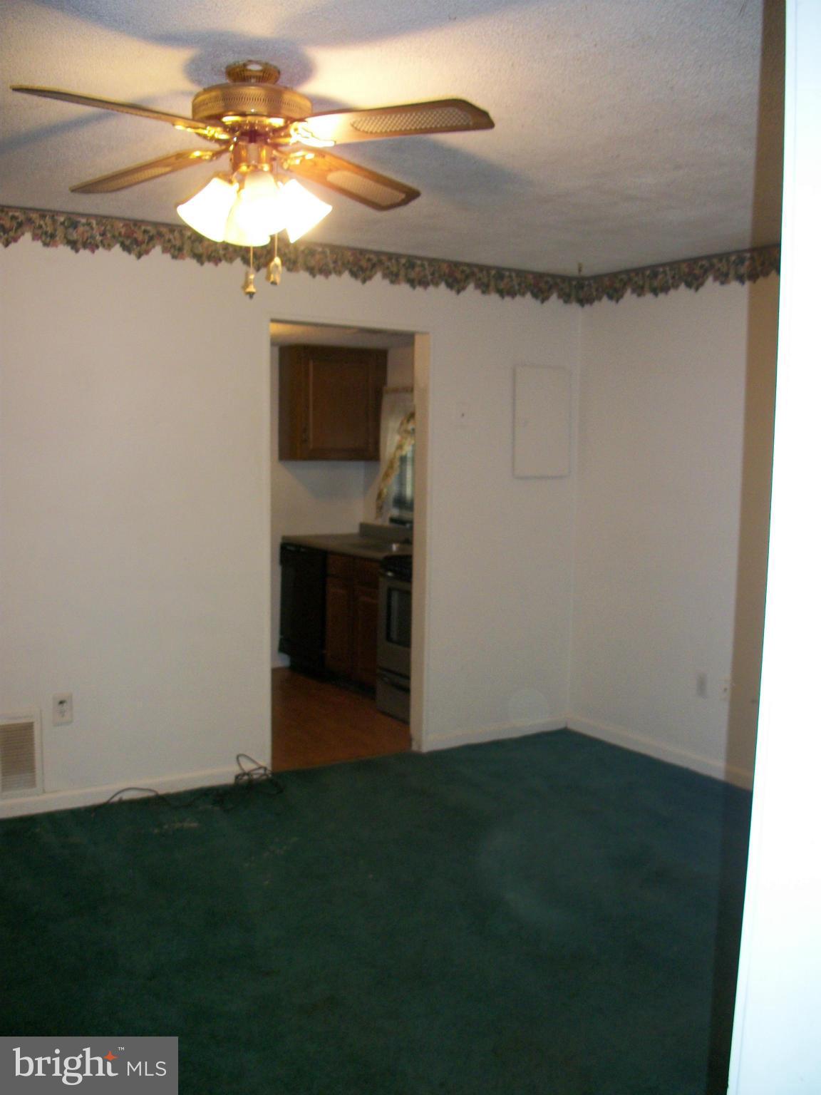 8573 Beacon Point Road Pasadena, MD 21122 - Photo 6 of 8 Large LR off kitchen and main hall