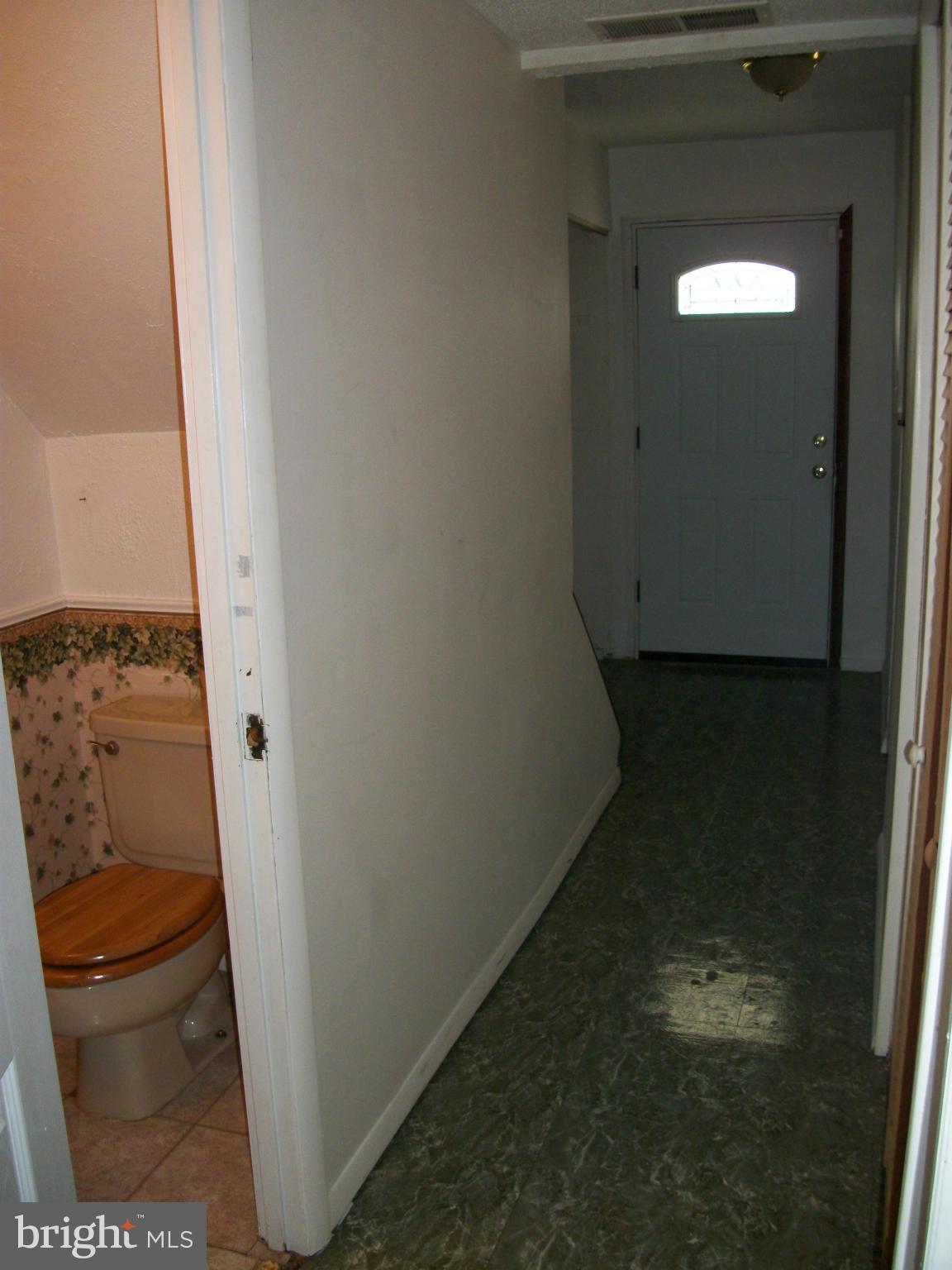 8573 Beacon Point Road Pasadena, MD 21122 - Photo 7 of 8 Powder room off main hall