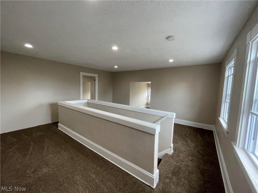 1843 Farmington Road Cleveland, OH 44112 - Photo 34 of 48 Large 3rd floor landing with new carpeting, HVAC vents and recessed lighting