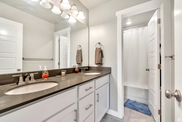 3232 West 1670th Street North Provo, UT 84601 - Photo 20 of 33 Bathroom with double vanity, light tile patterned floors, and shower / bath combo