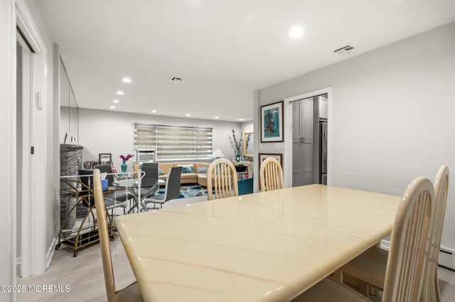 a very nice looking dining room with furniture
