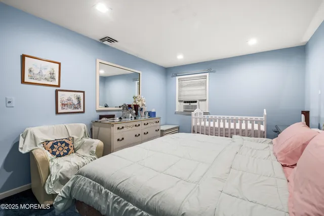 a bedroom with double bed and a window