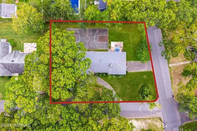 an aerial view of house with yard swimming pool and outdoor seating