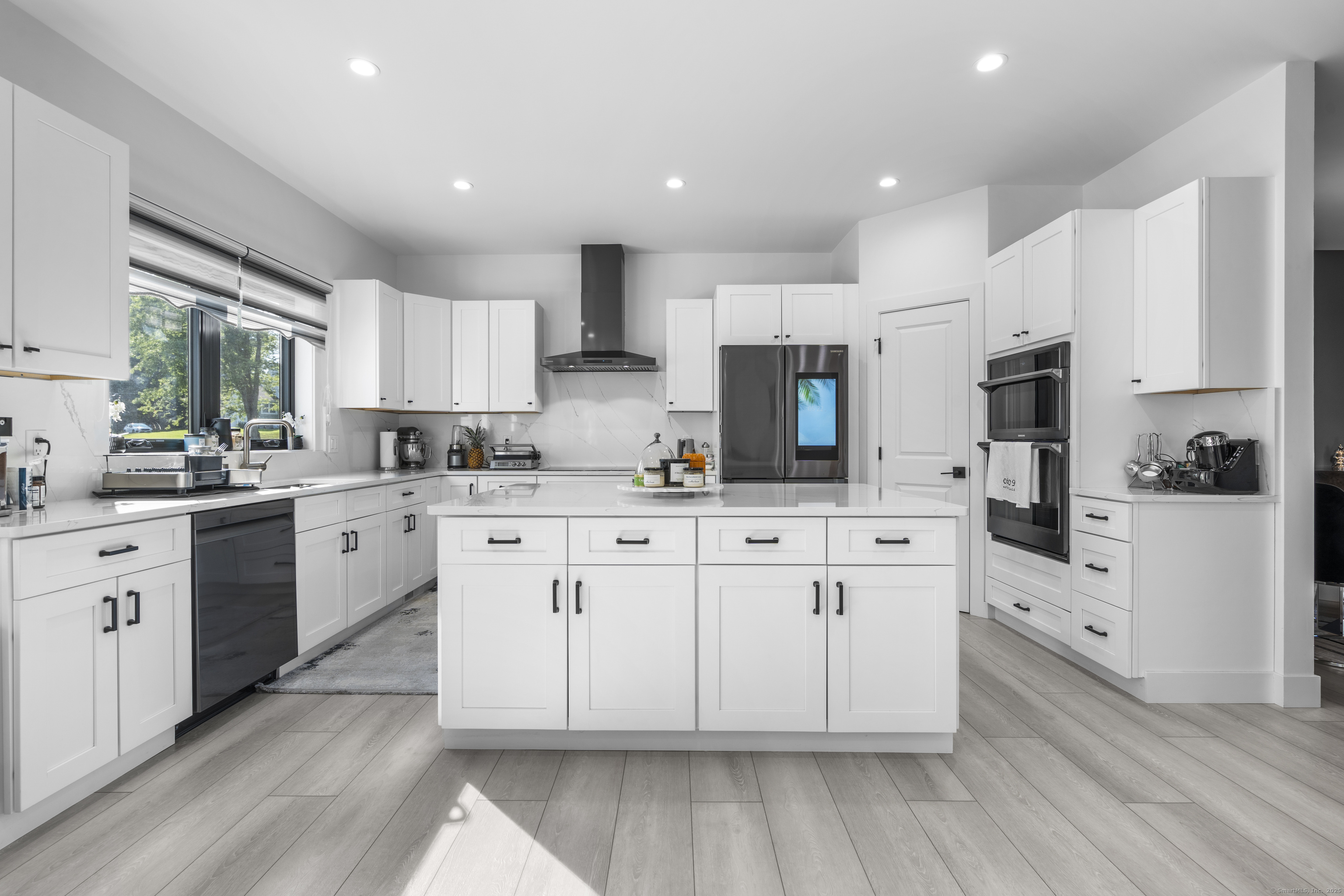 6 Vinnie Drive Wethersfield, CT 06109 - Photo 12 of 36 a kitchen with cabinets stainless steel appliances a sink and a window