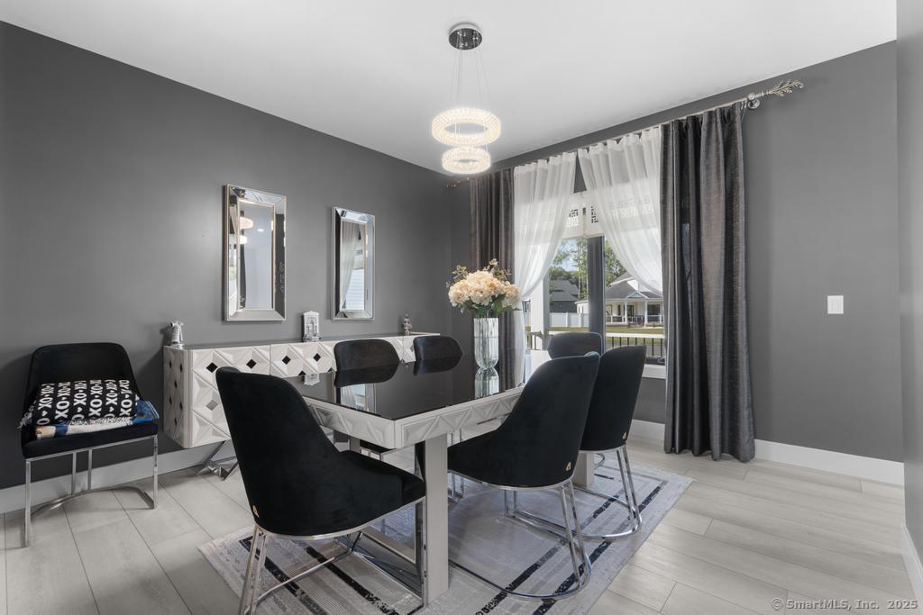 6 Vinnie Drive Wethersfield, CT 06109 - Photo 13 of 36 a dining room with furniture and wooden floor