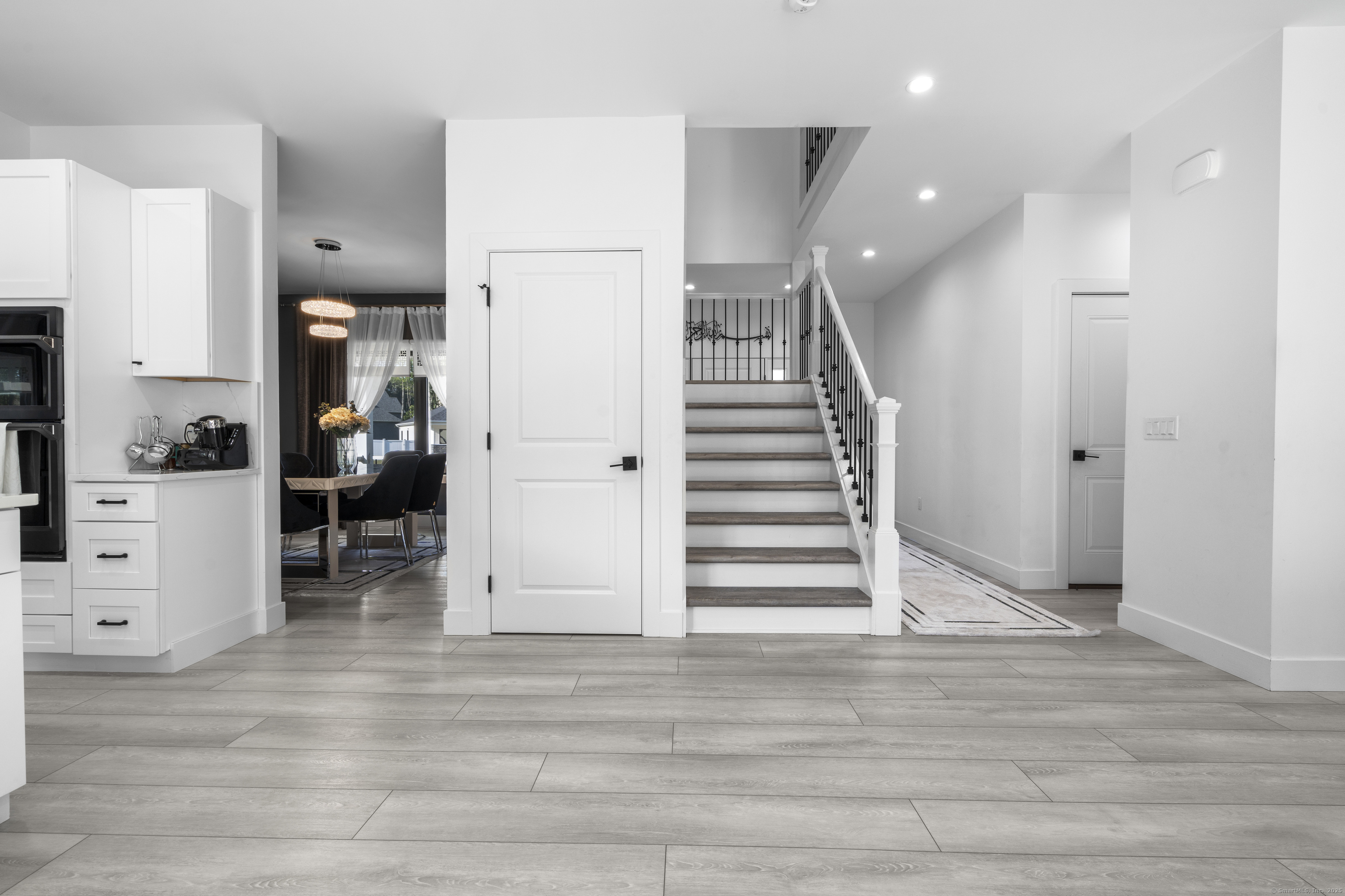 6 Vinnie Drive Wethersfield, CT 06109 - Photo 15 of 36 a view of entryway and hall with wooden floor