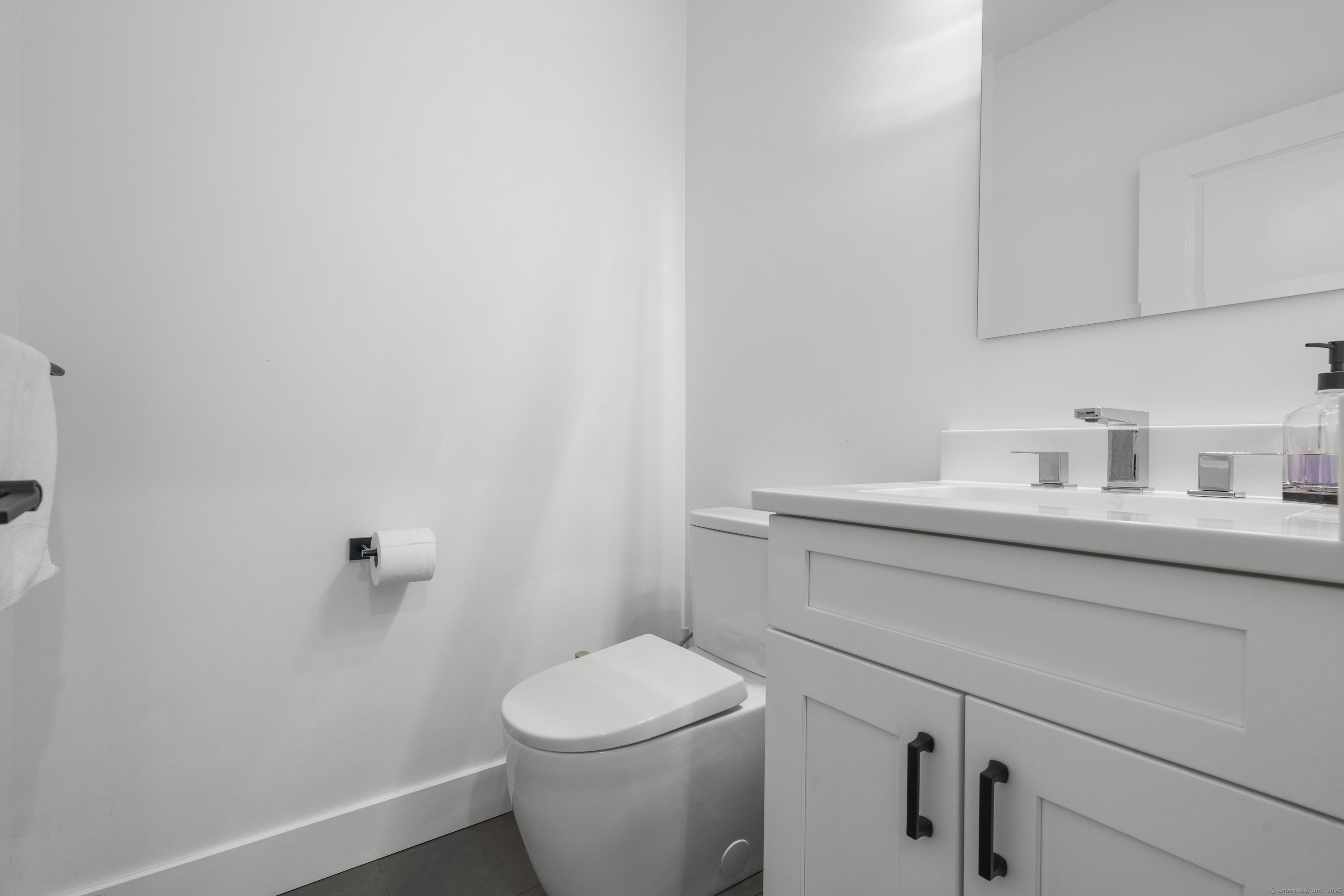 6 Vinnie Drive Wethersfield, CT 06109 - Photo 18 of 36 a bathroom with a sink a toilet and vanity