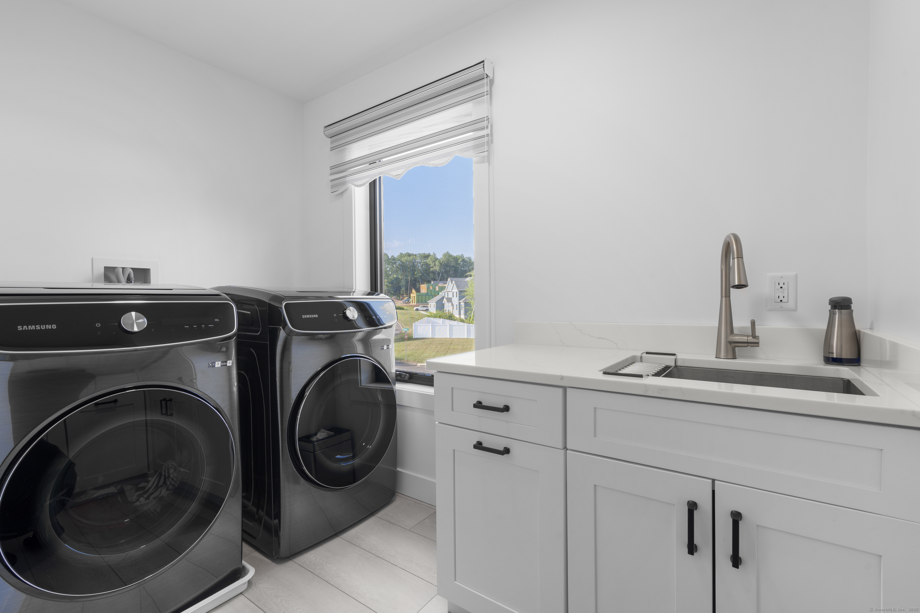 6 Vinnie Drive Wethersfield, CT 06109 - Photo 30 of 36 a utility room with sink dryer and washer