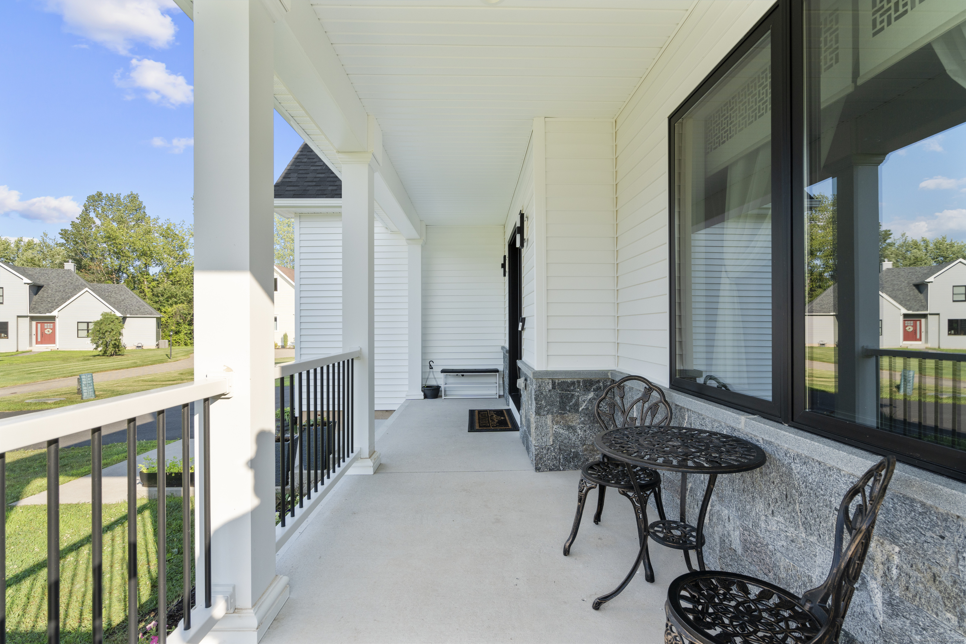 6 Vinnie Drive Wethersfield, CT 06109 - Photo 3 of 36 a balcony with furniture and wooden floor