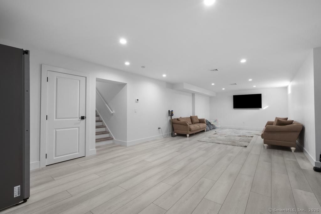 6 Vinnie Drive Wethersfield, CT 06109 - Photo 31 of 36 a living room with furniture and a flat screen tv