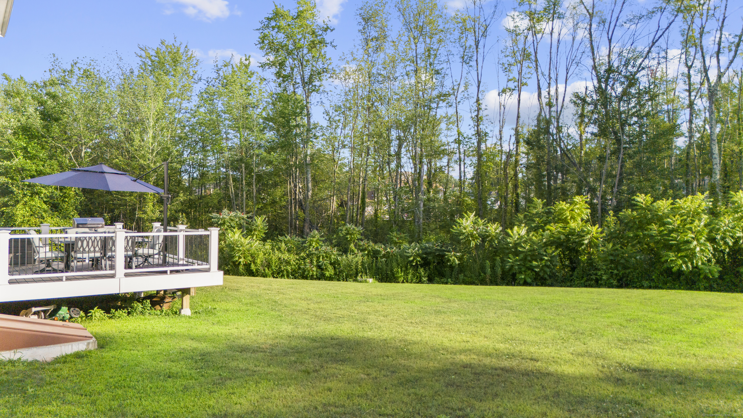 6 Vinnie Drive Wethersfield, CT 06109 - Photo 7 of 36 a view of a swimming pool with a table and chairs under an umbrella