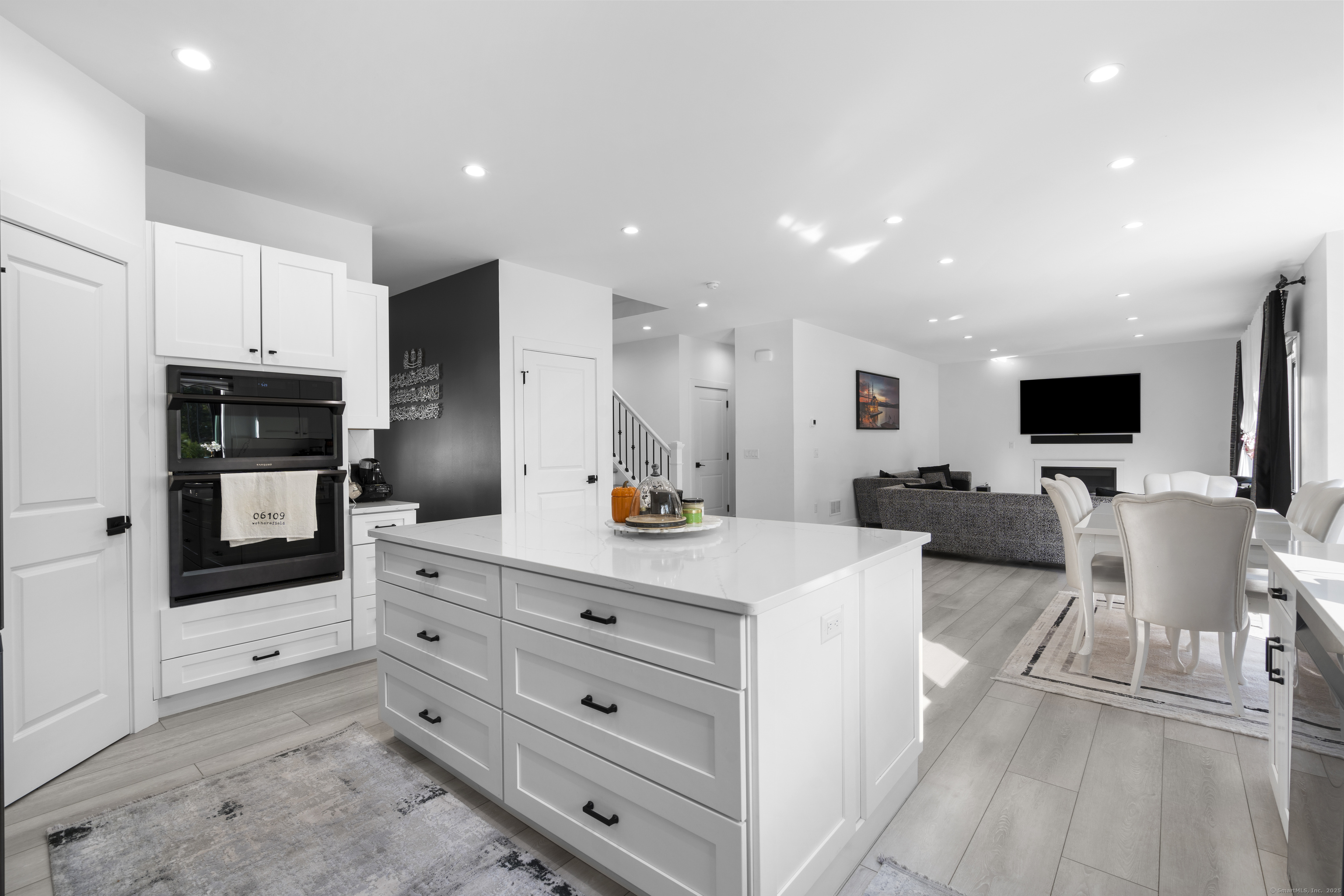 6 Vinnie Drive Wethersfield, CT 06109 - Photo 10 of 36 a kitchen with stainless steel appliances kitchen island granite countertop a refrigerator and cabinets