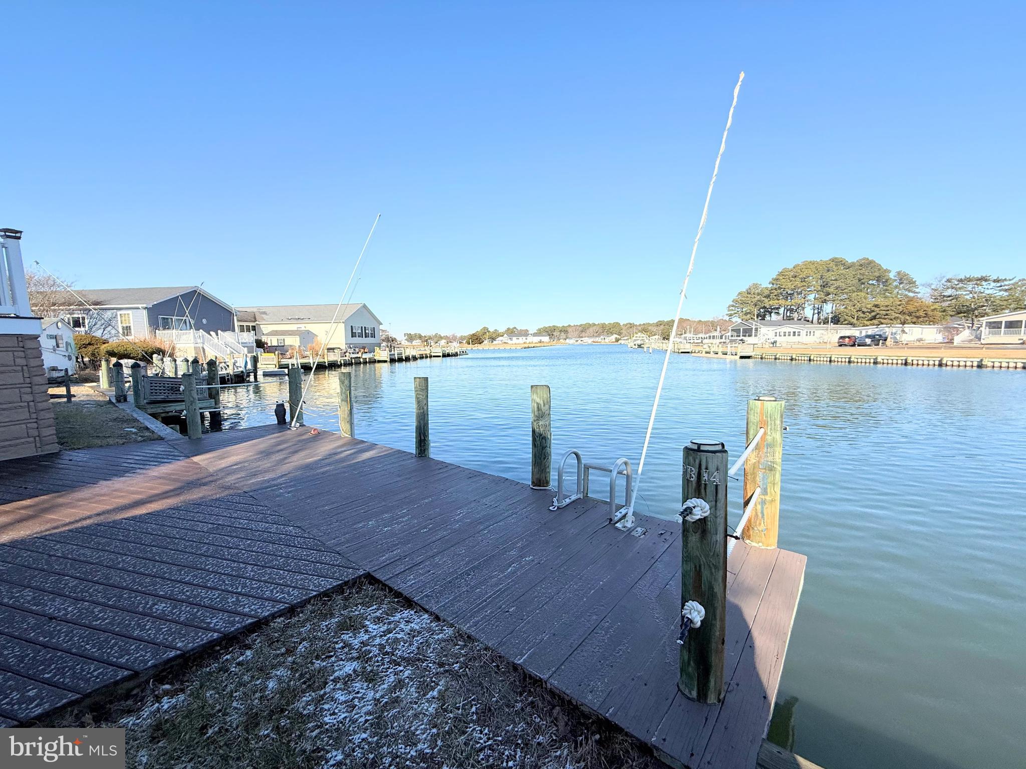 37097 Sandpiper Road, Unit 9 Long Neck, DE 19966 - Photo 12 of 54 private boat dock in backyard