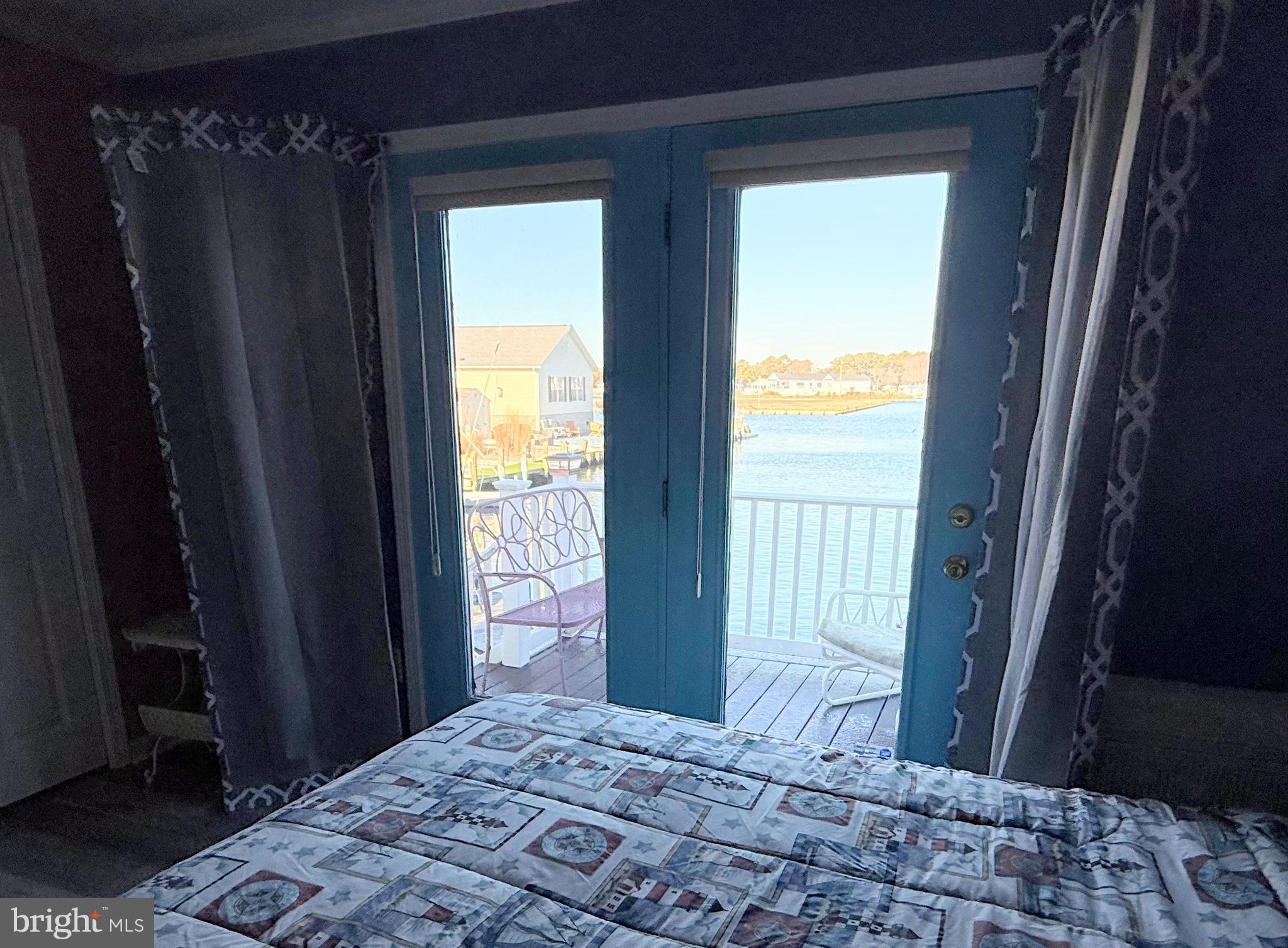 37097 Sandpiper Road, Unit 9 Long Neck, DE 19966 - Photo 32 of 54 private water view deck off primary bedroom