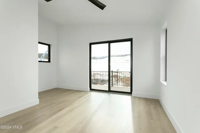 a view of a balcony with wooden floor