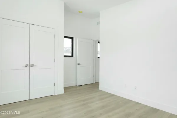 a view of a room with racks on the wall