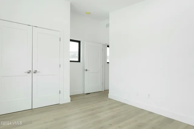 a view of a room with racks on the wall