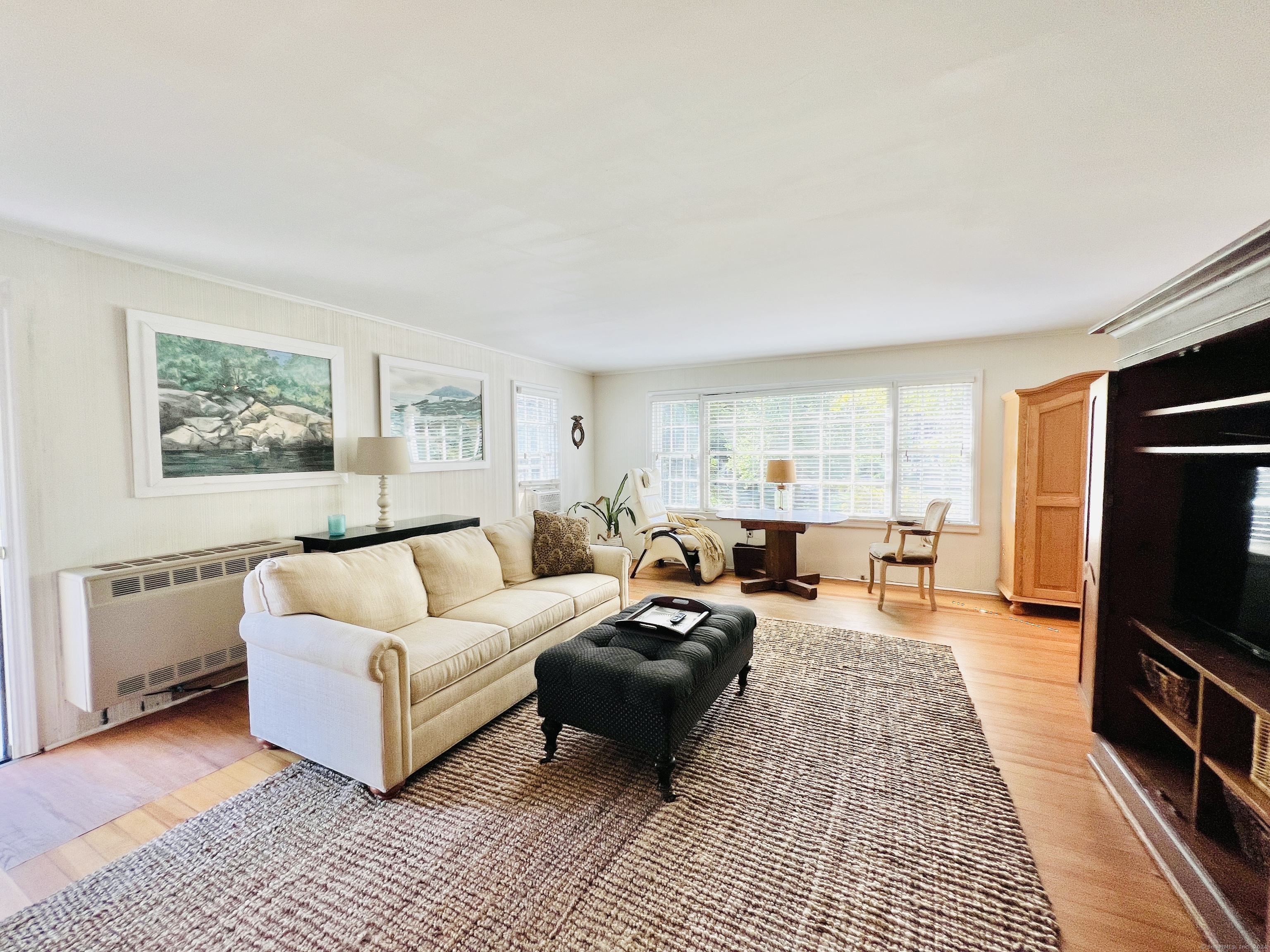 301 Haviland Road Stamford, CT 06903 - Photo 11 of 34 a living room with furniture a rug and a flat screen tv