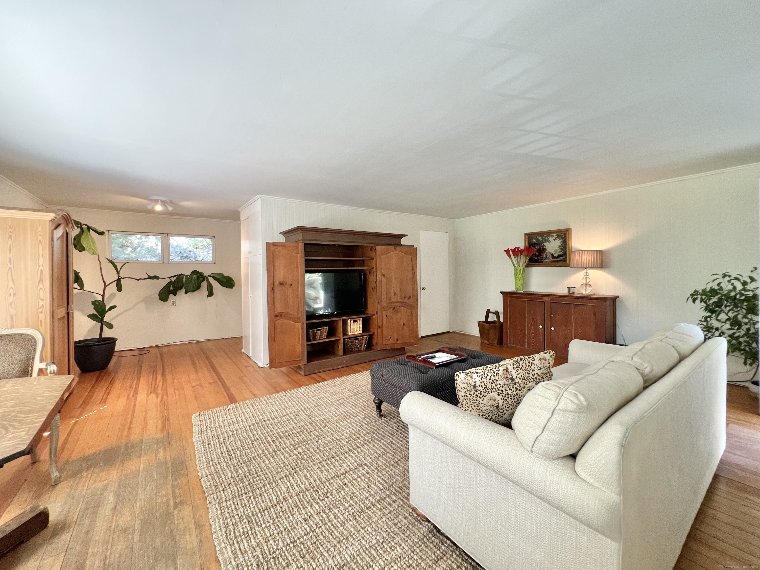 301 Haviland Road Stamford, CT 06903 - Photo 12 of 34 a living room with furniture and a wooden floor