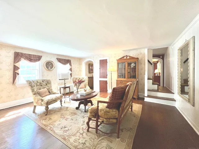 a living room with furniture and a table