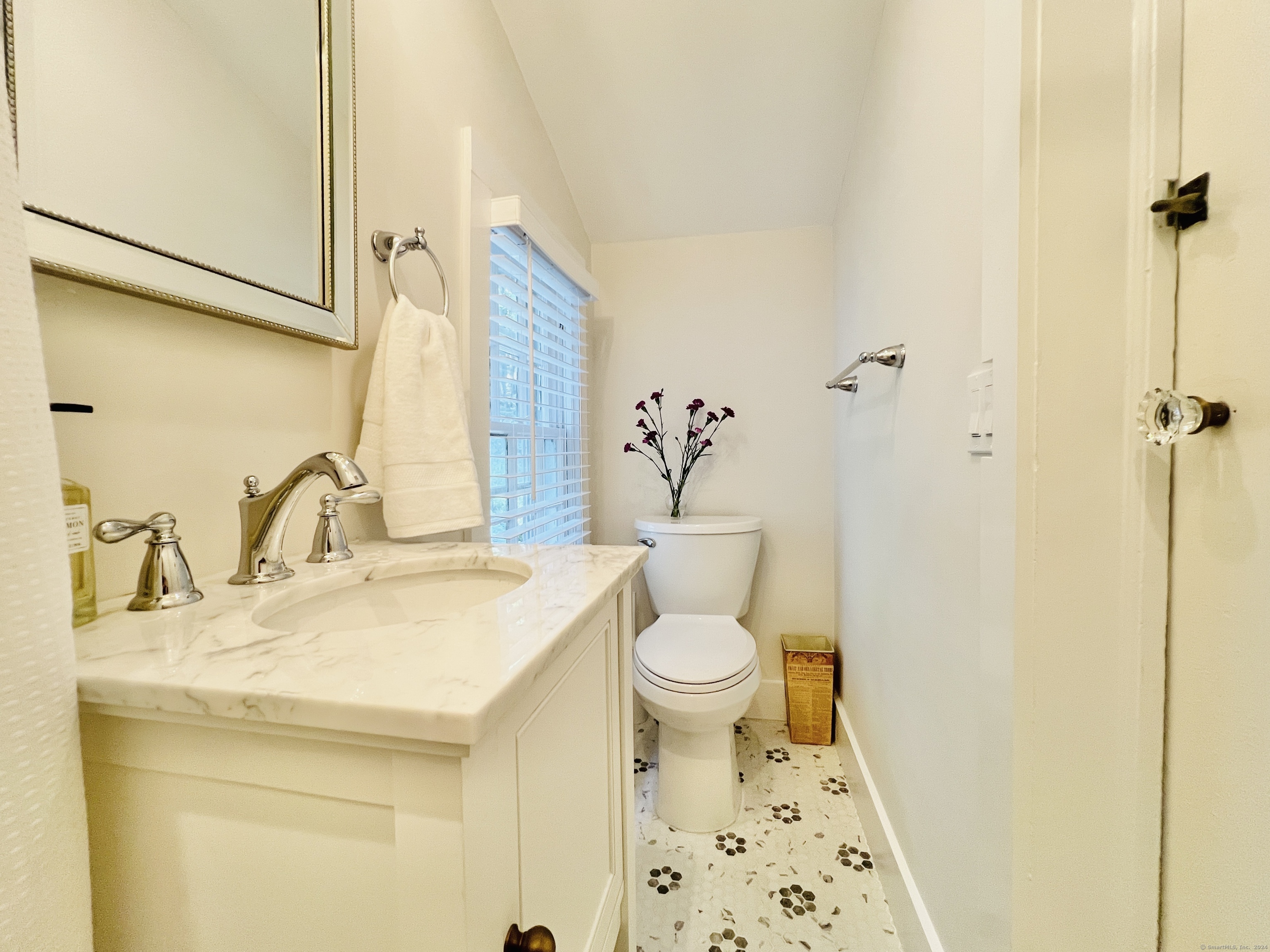 301 Haviland Road Stamford, CT 06903 - Photo 21 of 34 a bathroom with a sink a toilet and a mirror